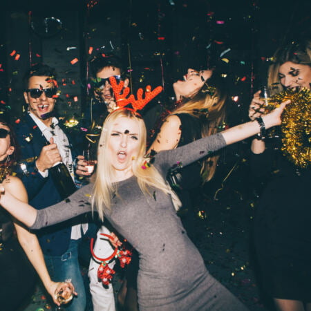 a group of people dancing with confetti